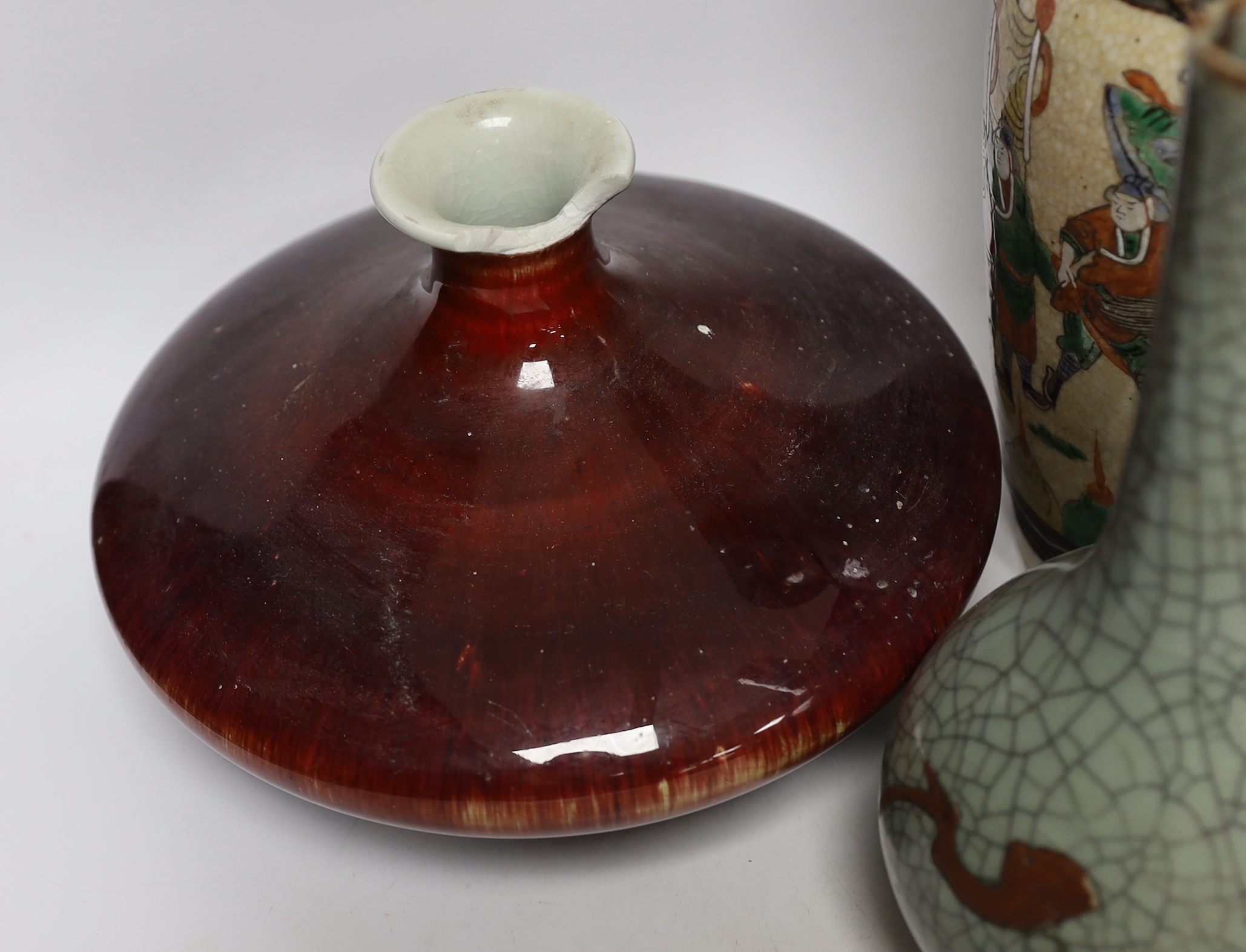 An 18th century Chinese export dish, a sang de boeuf squat vase, a crackle glaze bottle vase and a famille rose teapot, tallest 23cm